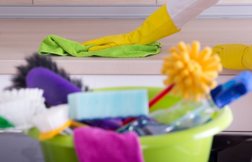 Cleaner working on kitchen surfaces during house cleaning in EN5
