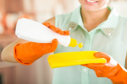 Tidying and mopping a communal landing in an EN5 property